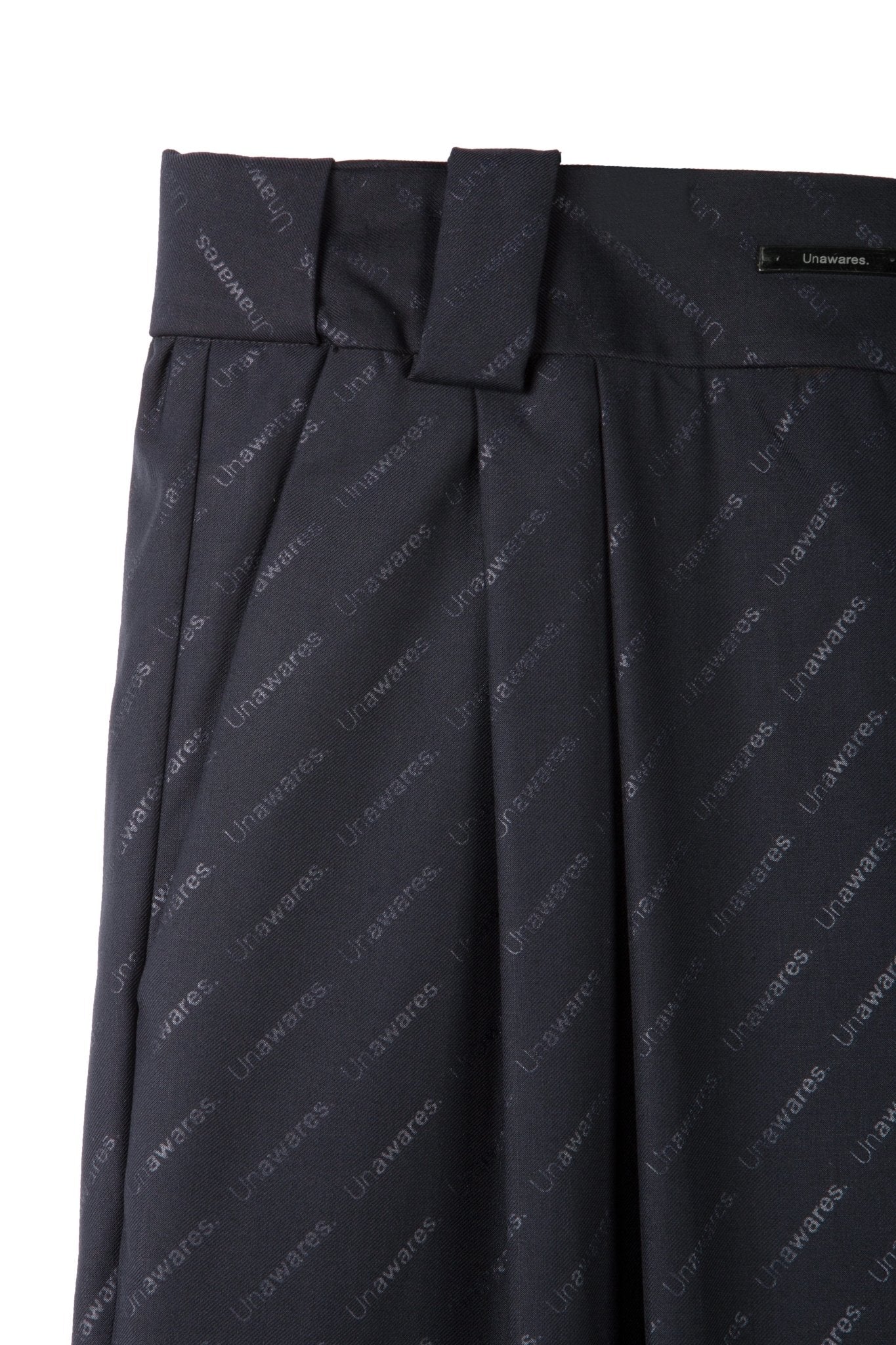 UNAWARES Brand Monogram Allover Steel Printed Loose Trousers | MADA IN CHINA